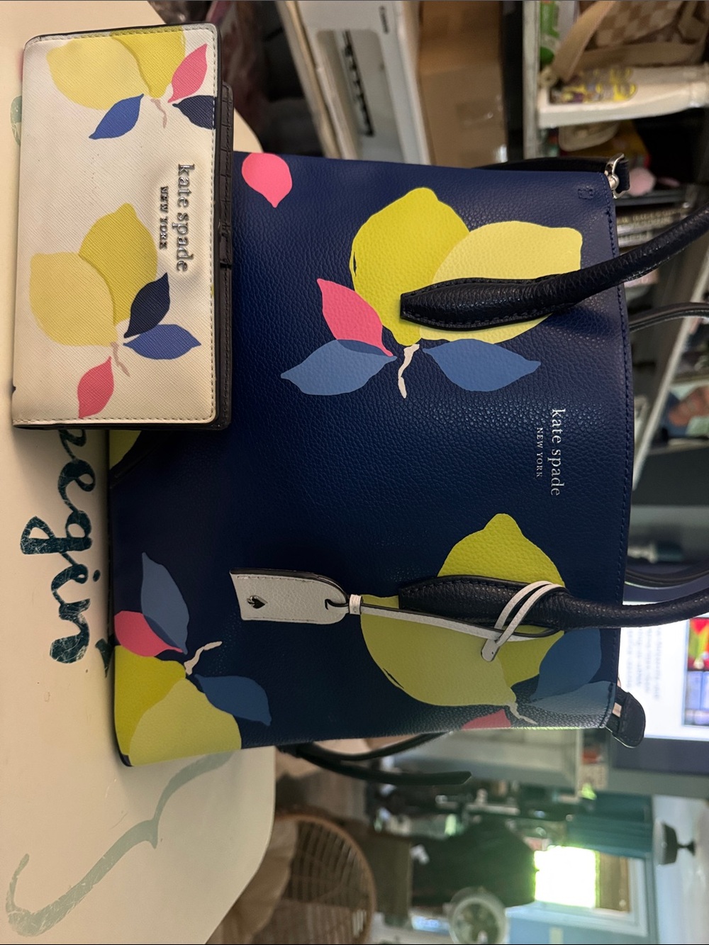 kate spade navy leather tote with yellow, pink and blue floral print